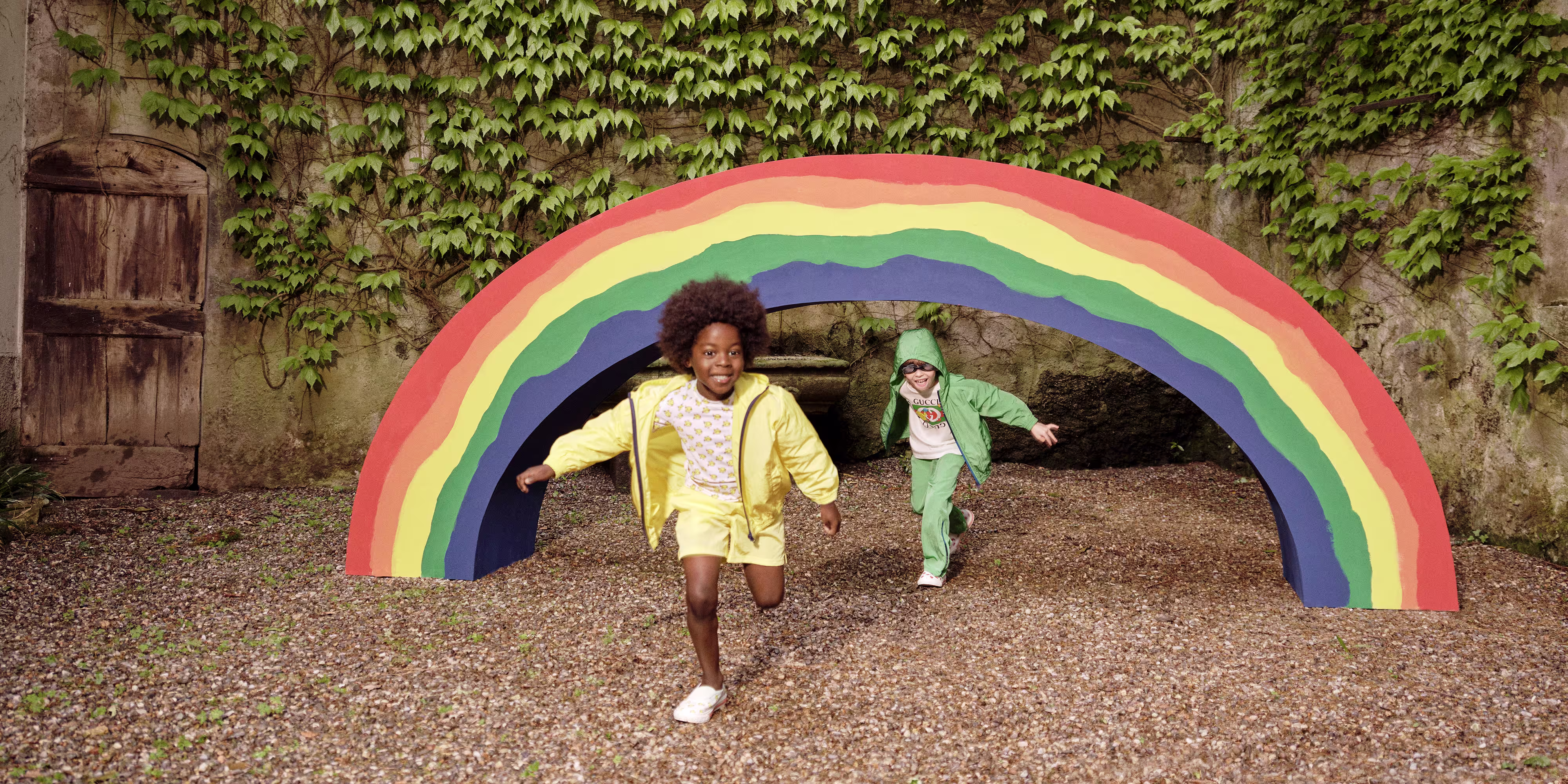 Green Gucci children's outfit outdoors