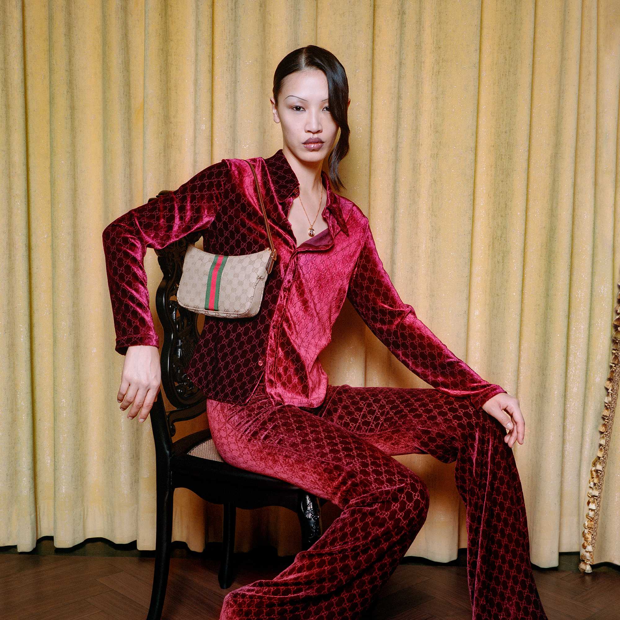Red Gucci velvet suit, handbag.