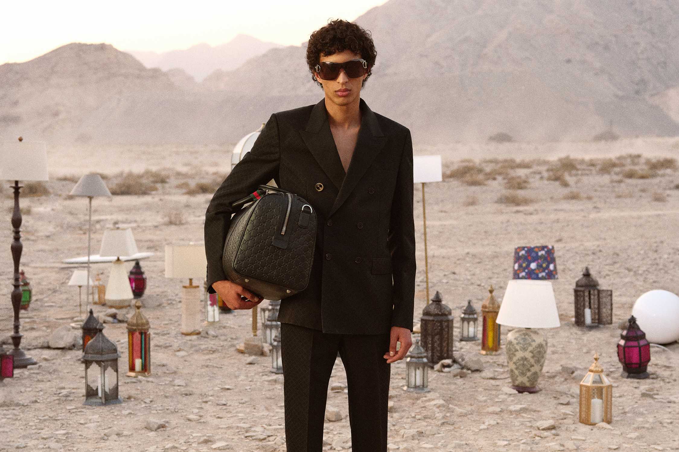 Black Gucci bag and sunglasses