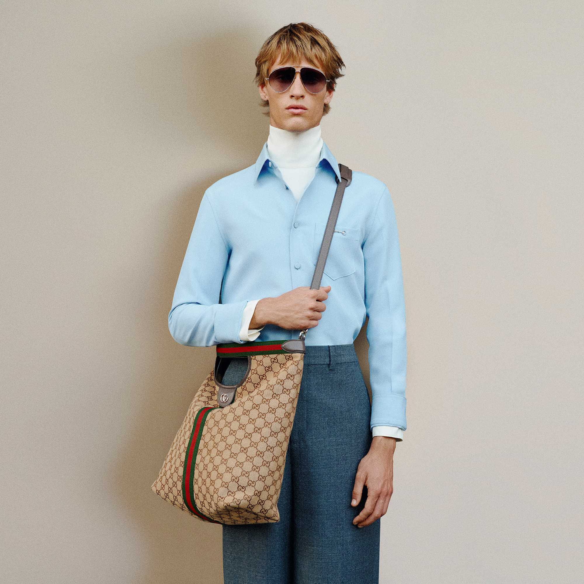 Grey suit with Gucci bag