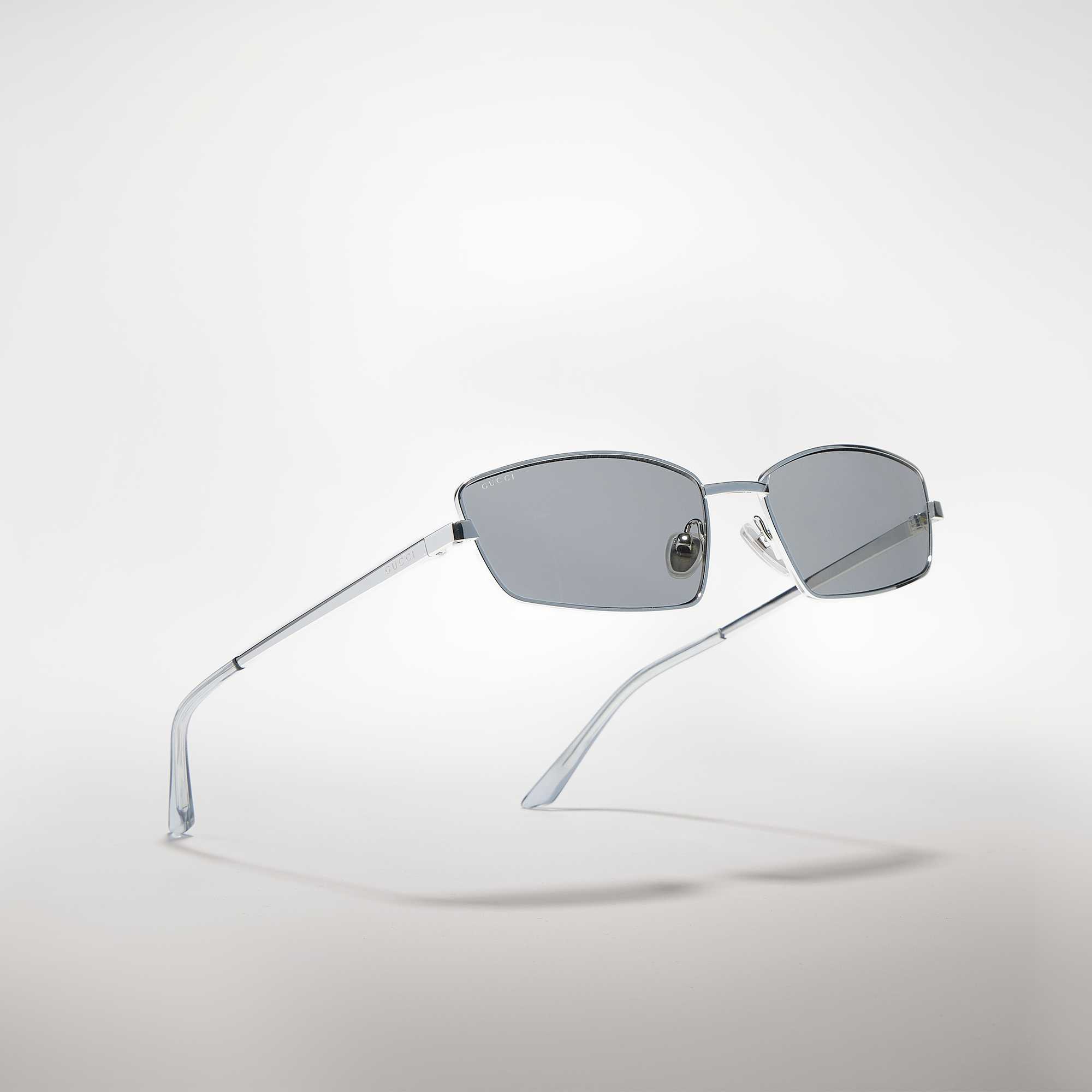 Black Gucci sunglasses, monogram bag