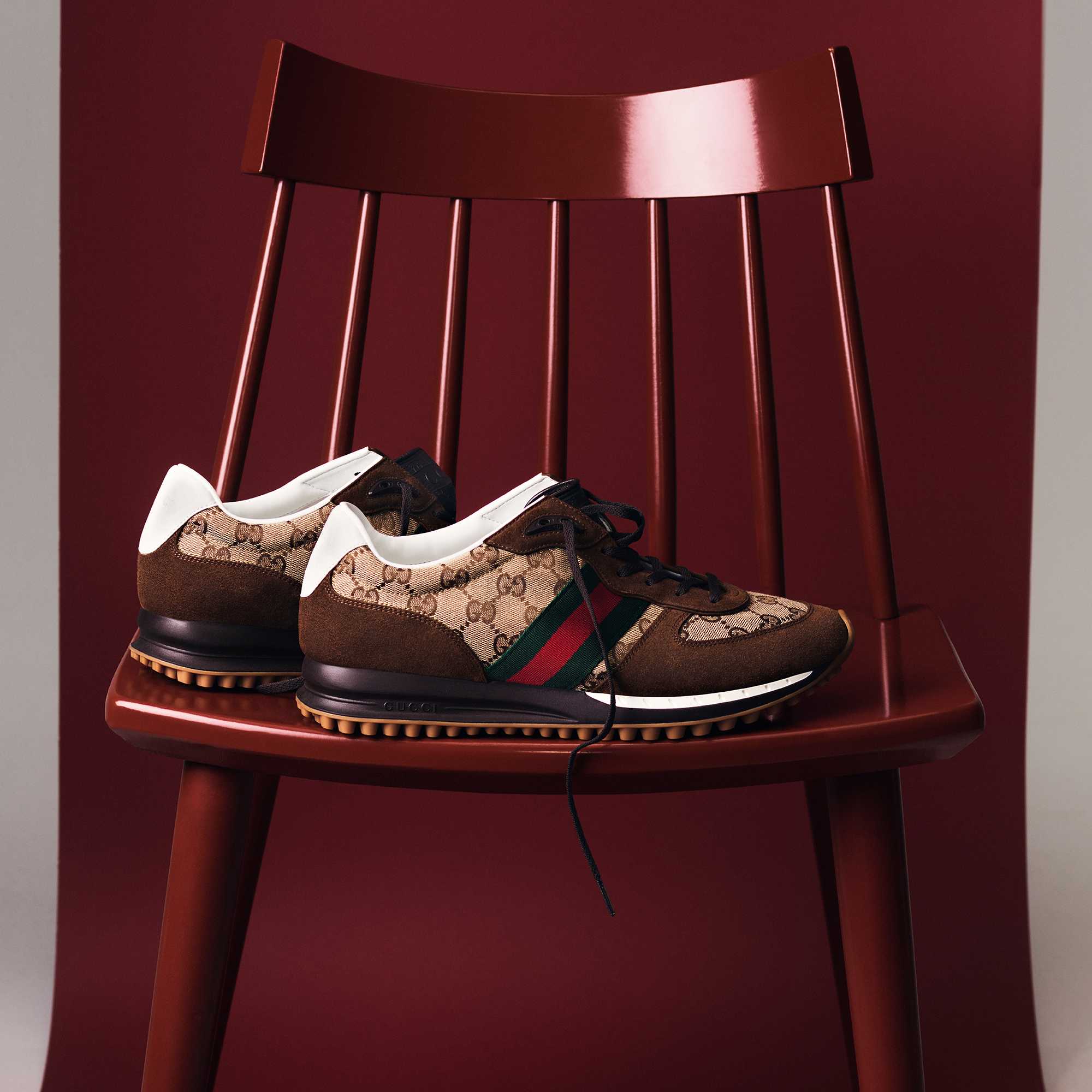Gucci Re-Motion sneakers on a chair