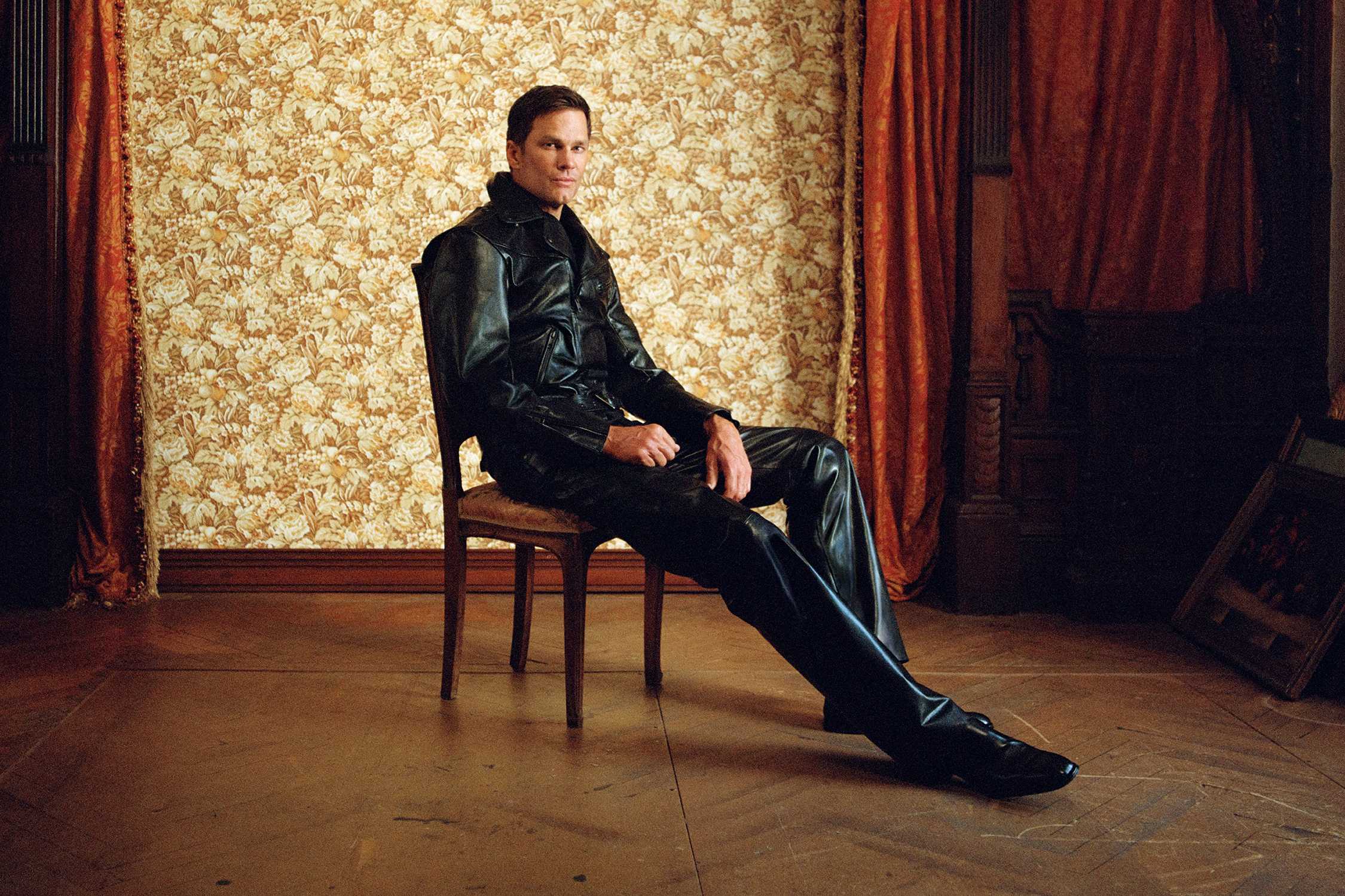 Black leather Gucci outfit seated