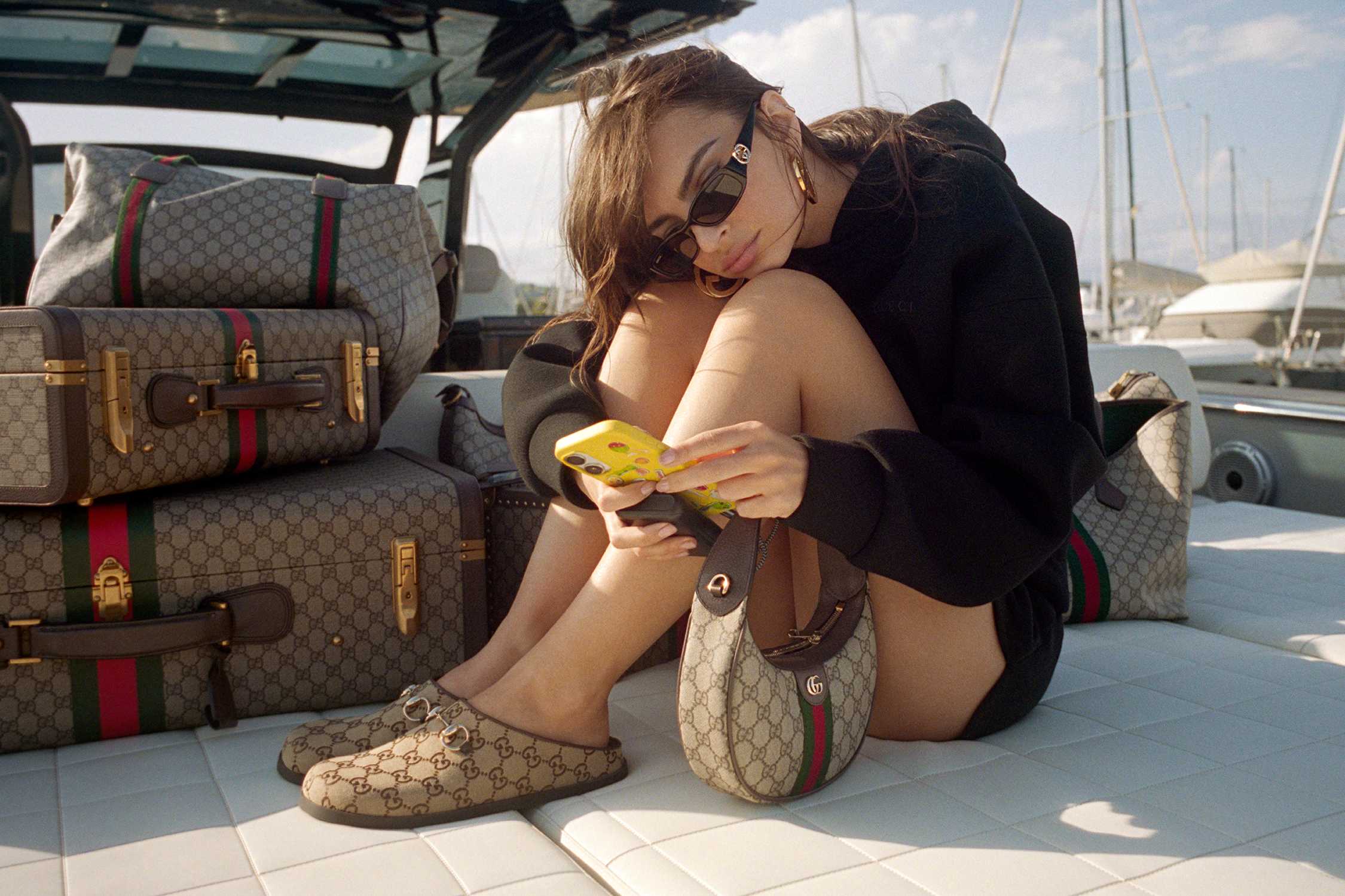 Gucci luggage and beige loafers