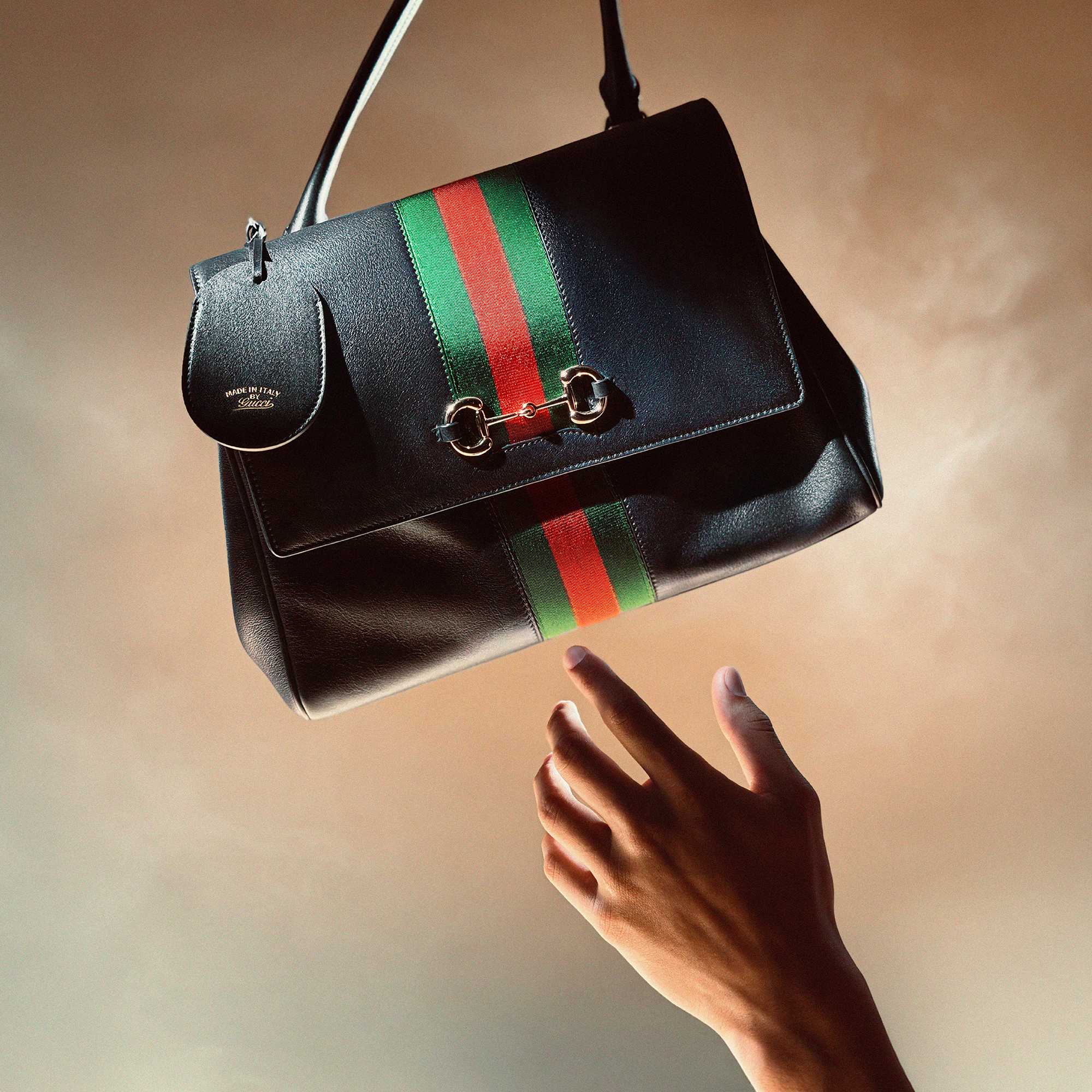 Black Gucci bag with stripes