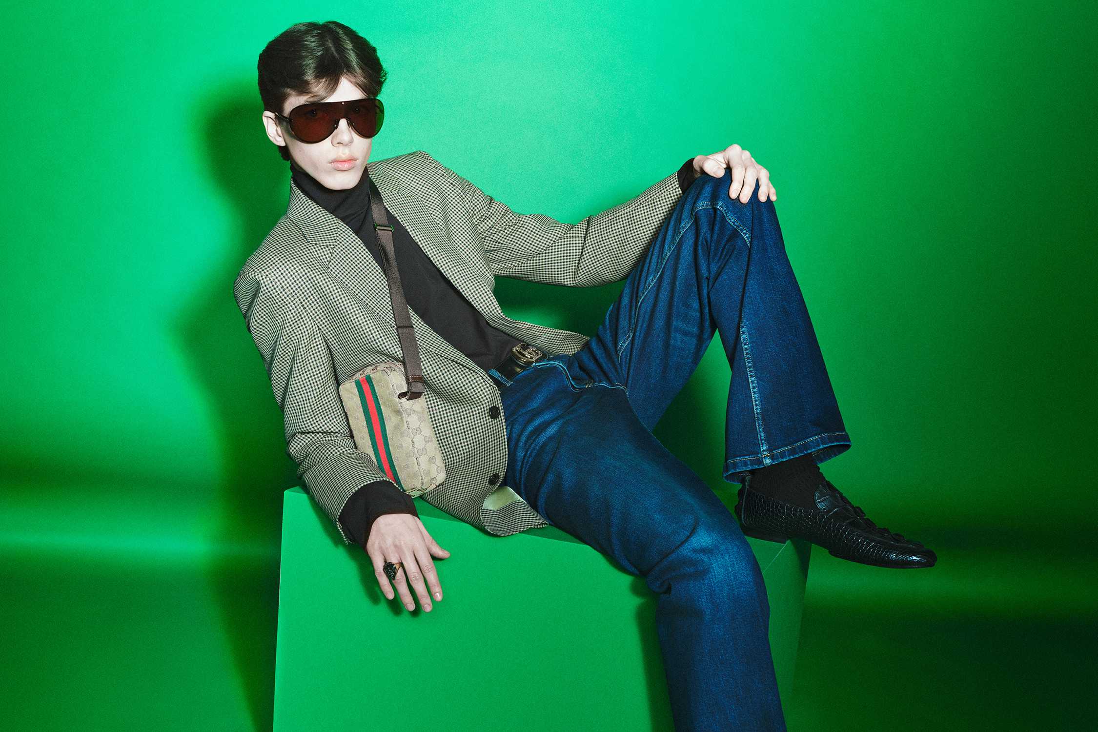 Gucci crossbody bag green background