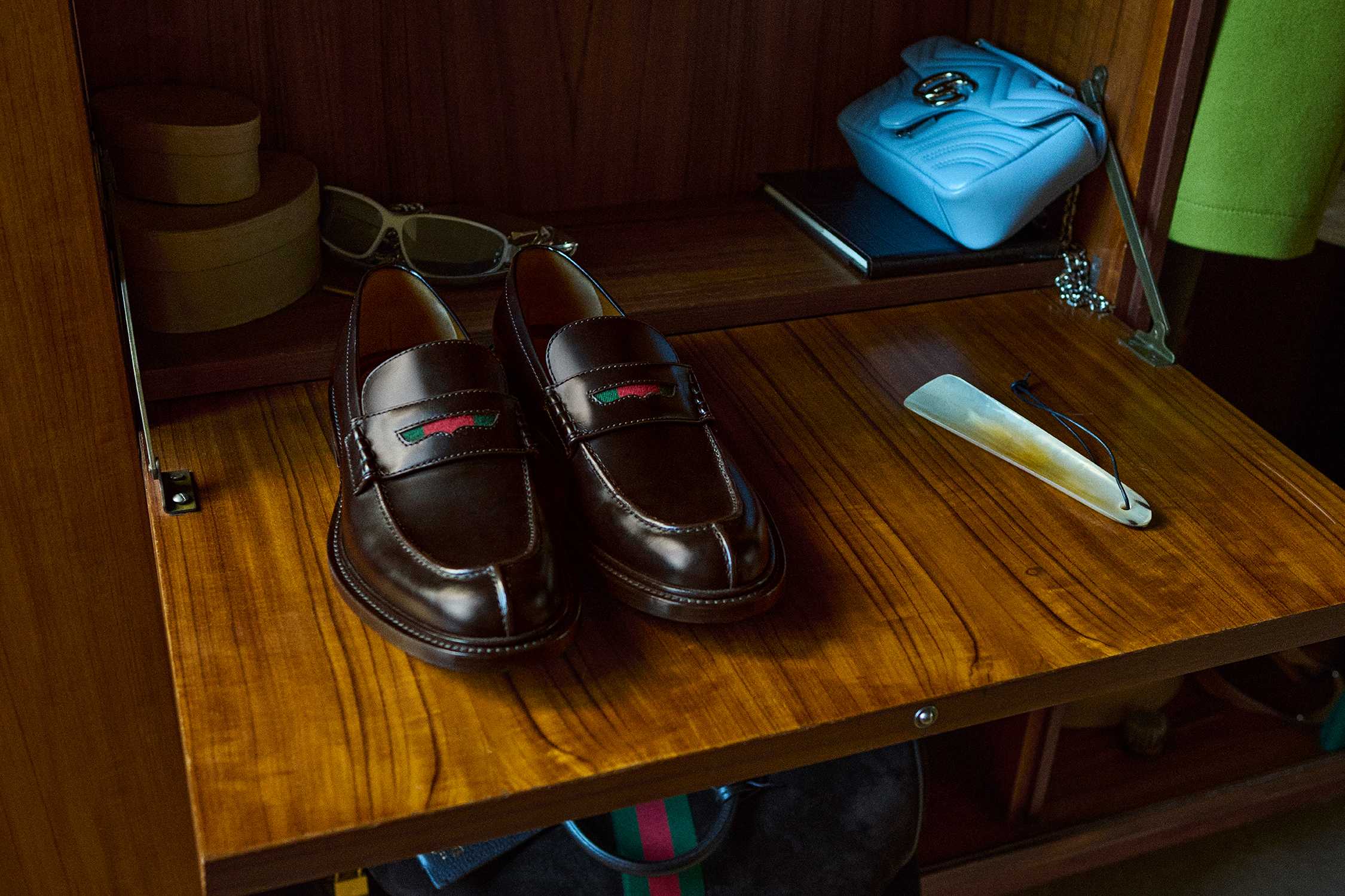 Brown Gucci loafers blue handbag
