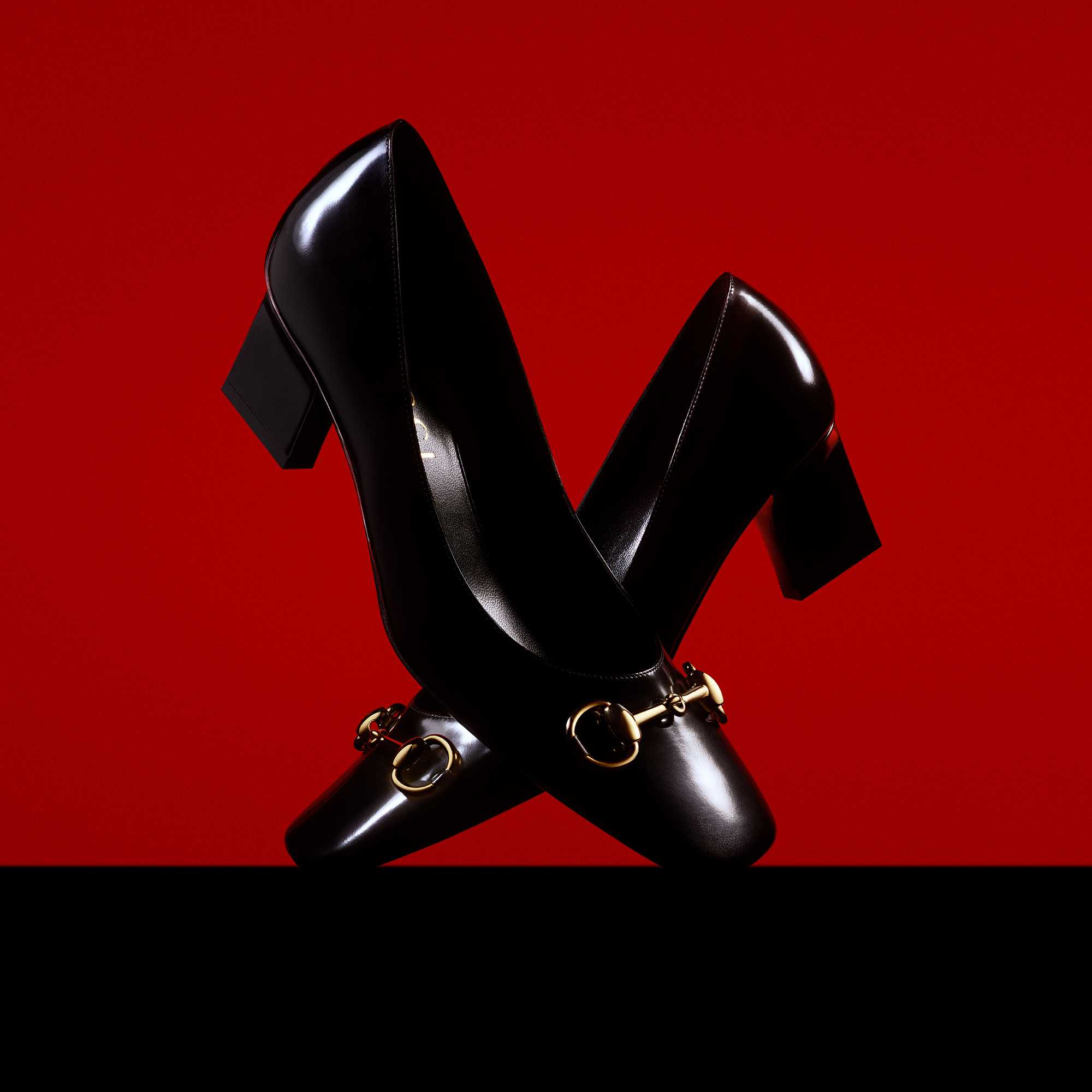 Black Gucci heels with gold hardware