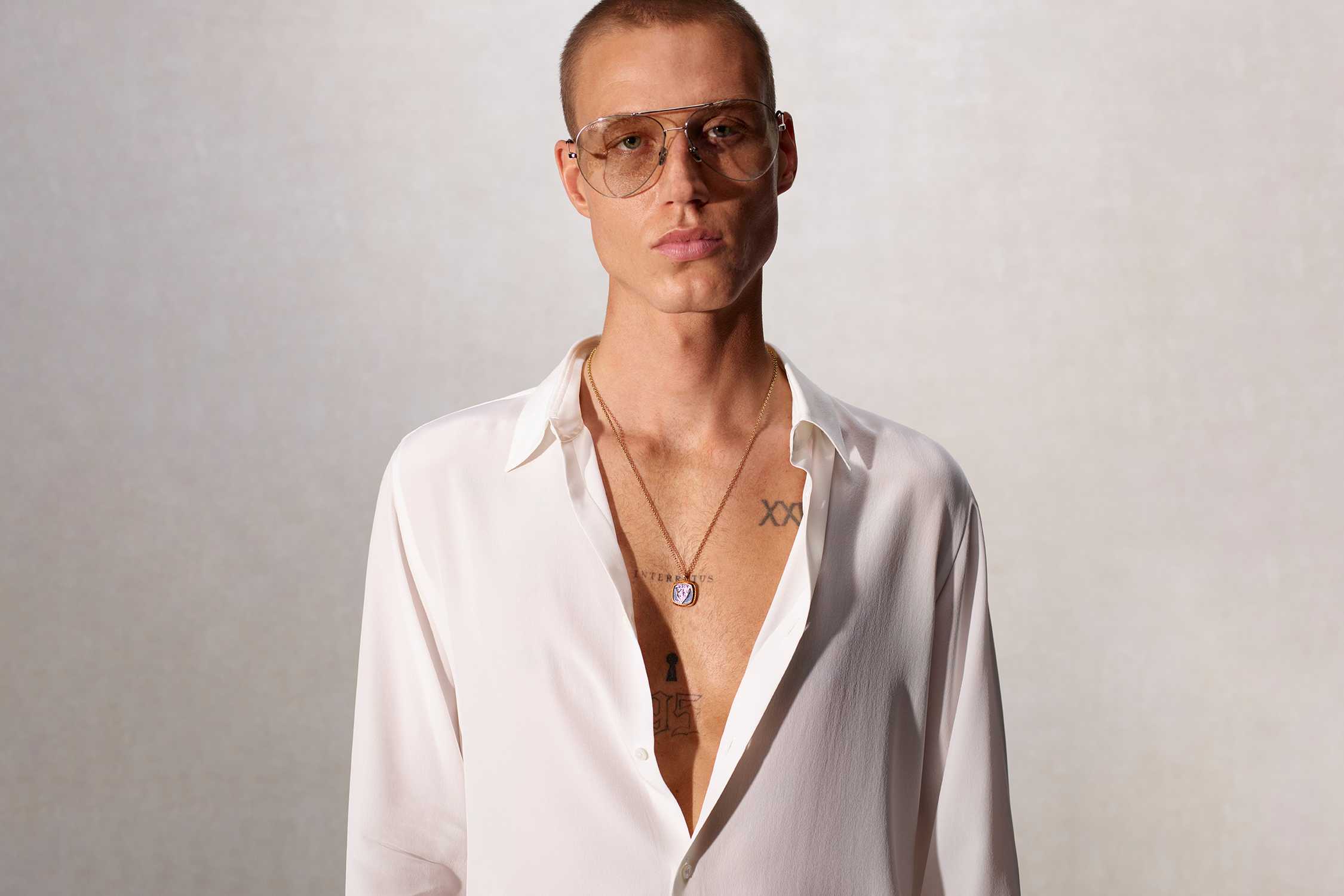 Gold Gucci pendant with shirt