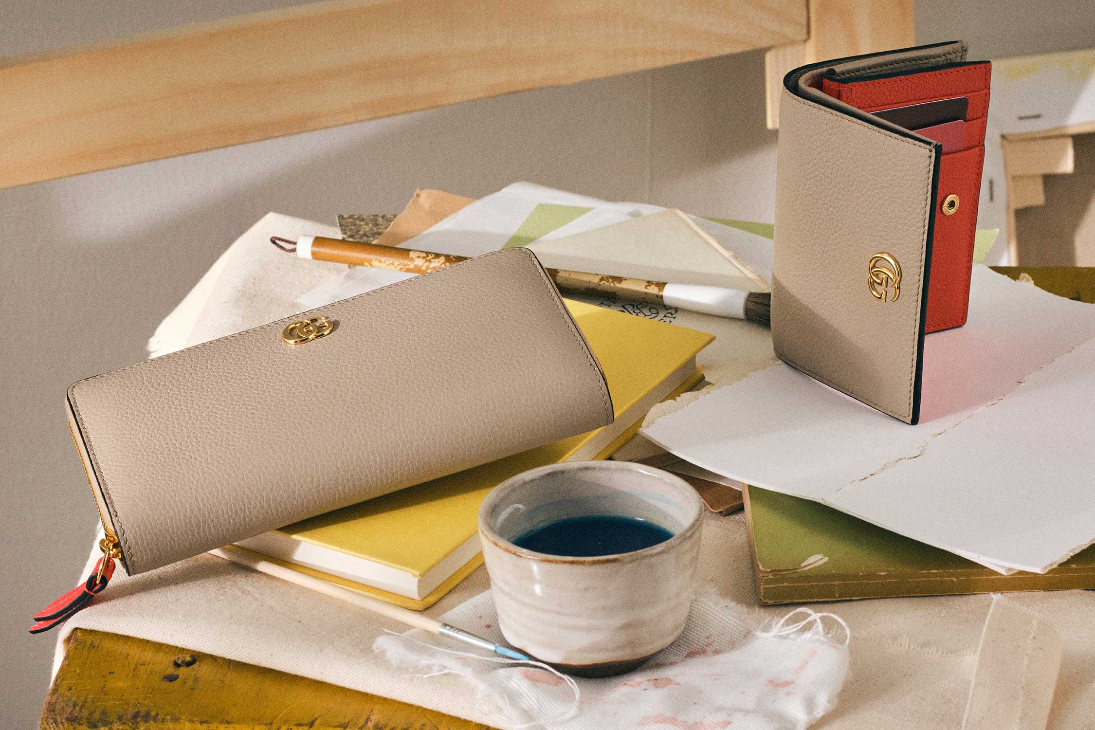Beige Gucci wallets with gold