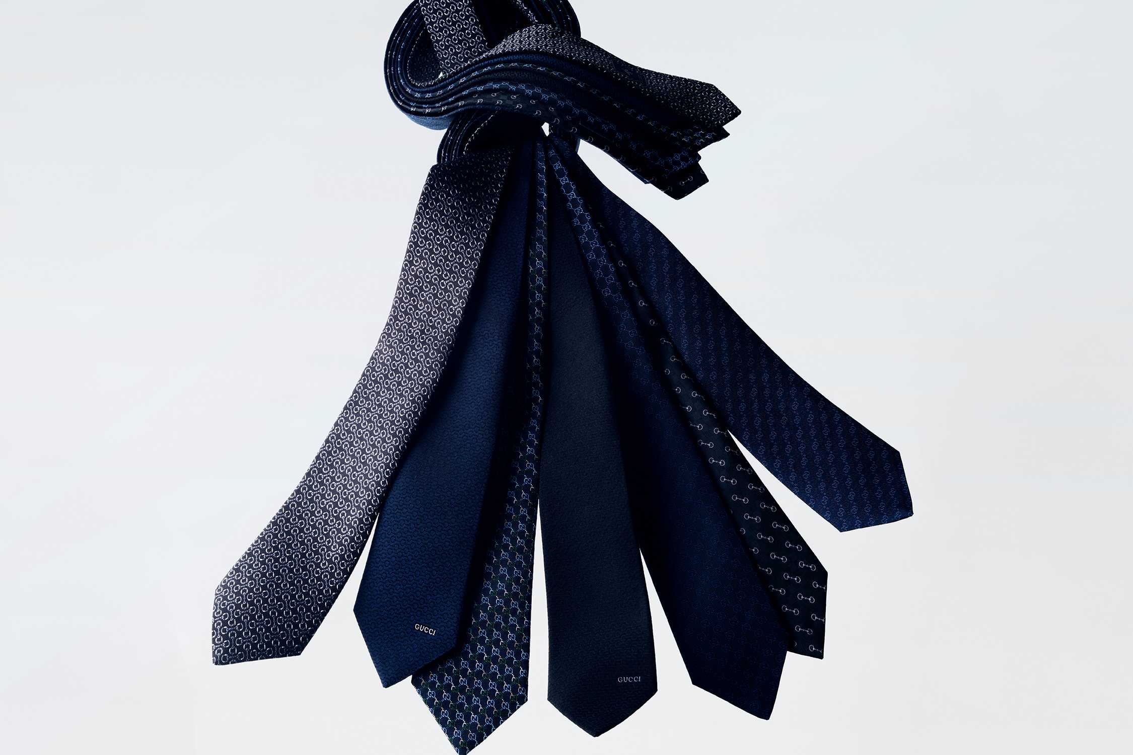Blue Gucci ties collection displayed