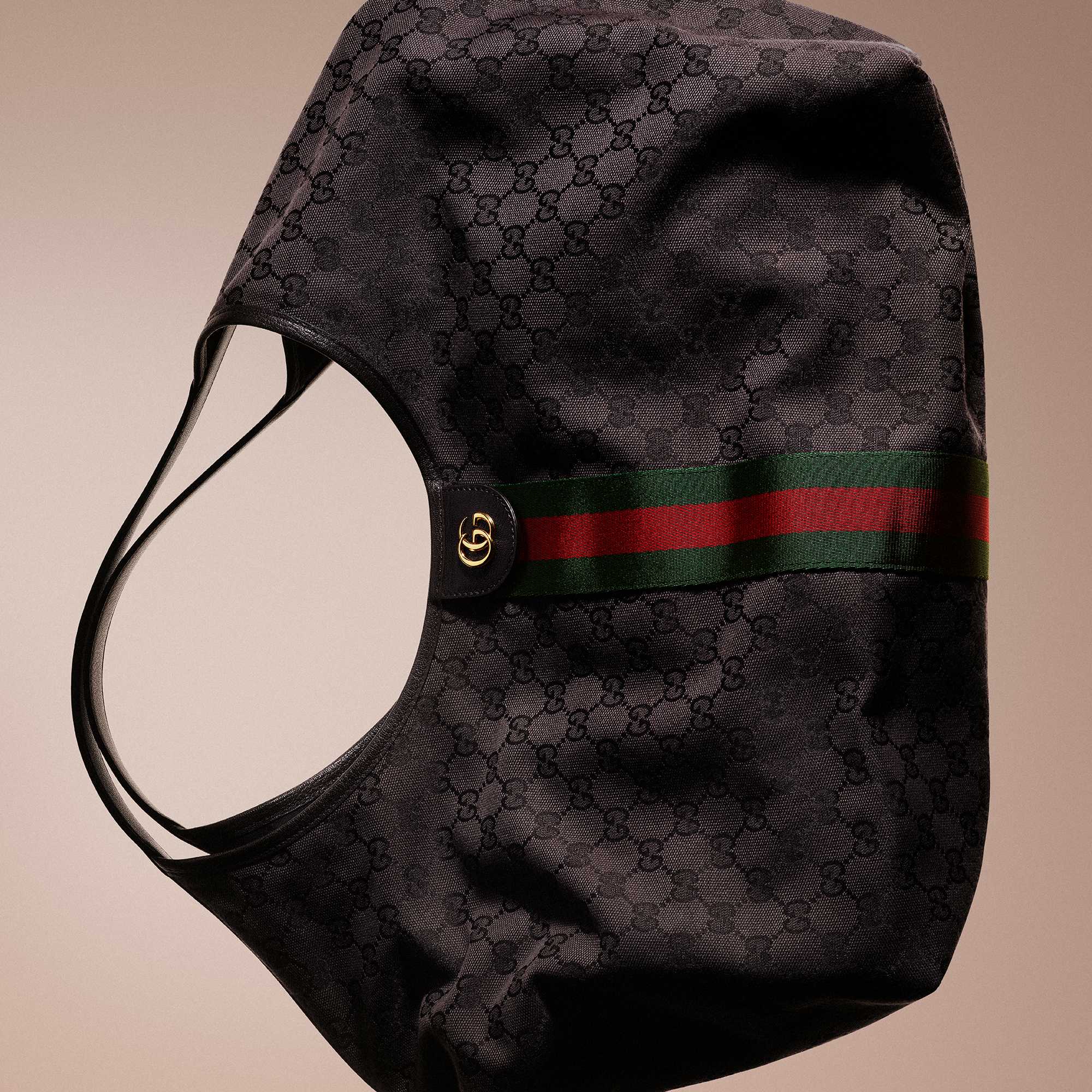 Brown Gucci bag with stripes.