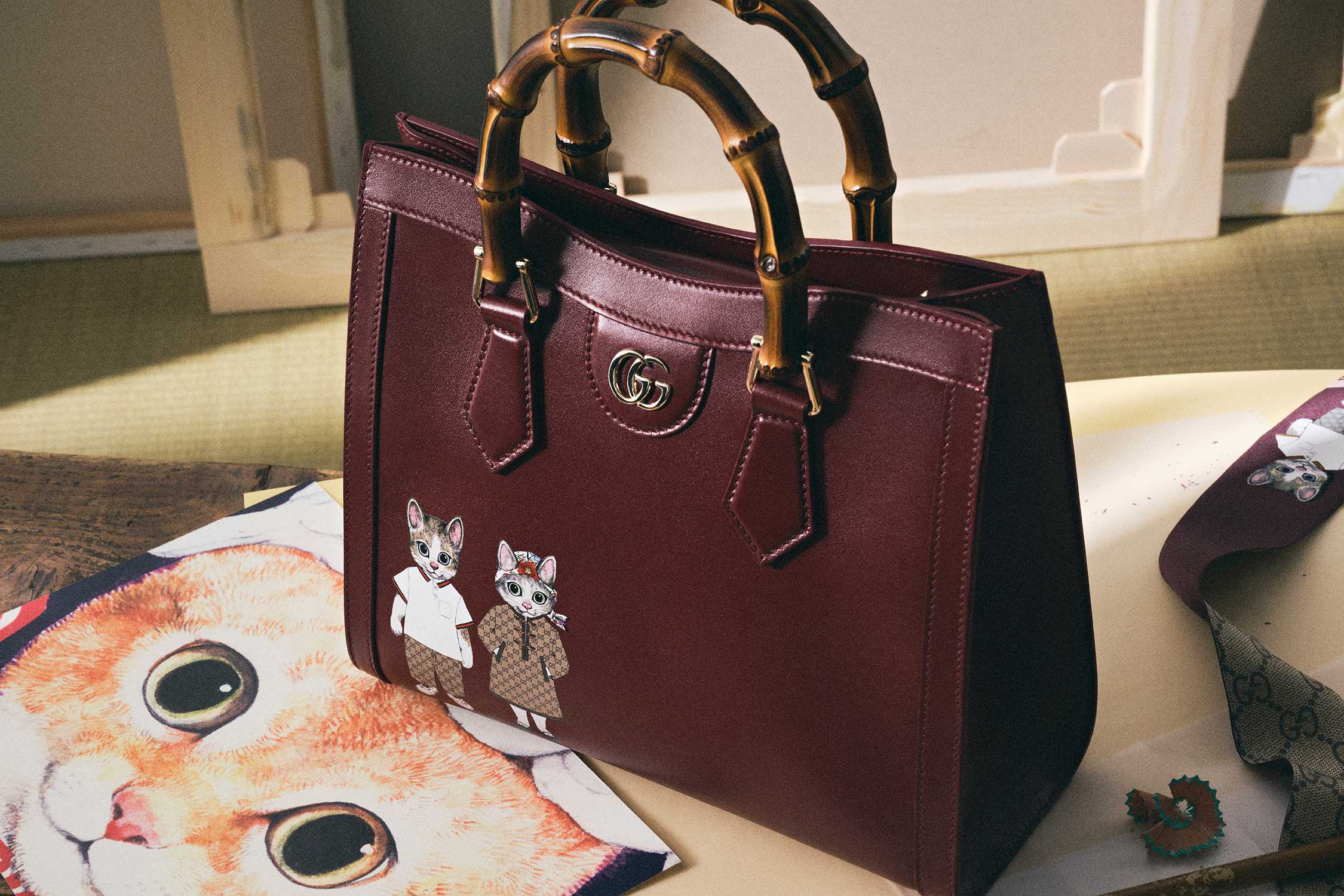 Burgundy Gucci bag bamboo handles