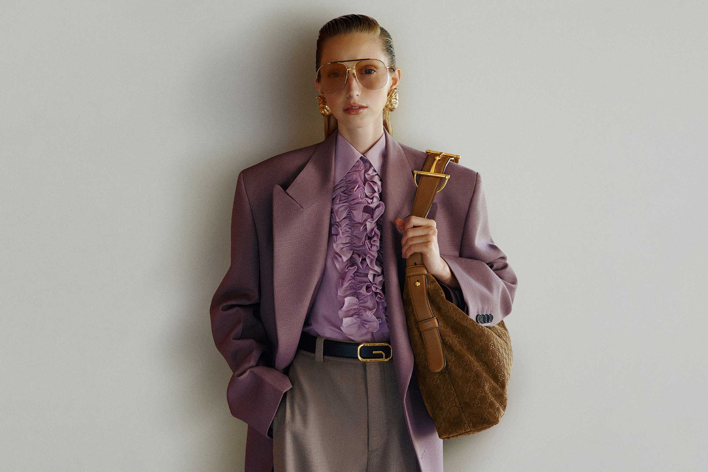 Brown Gucci bag with purple outfit
