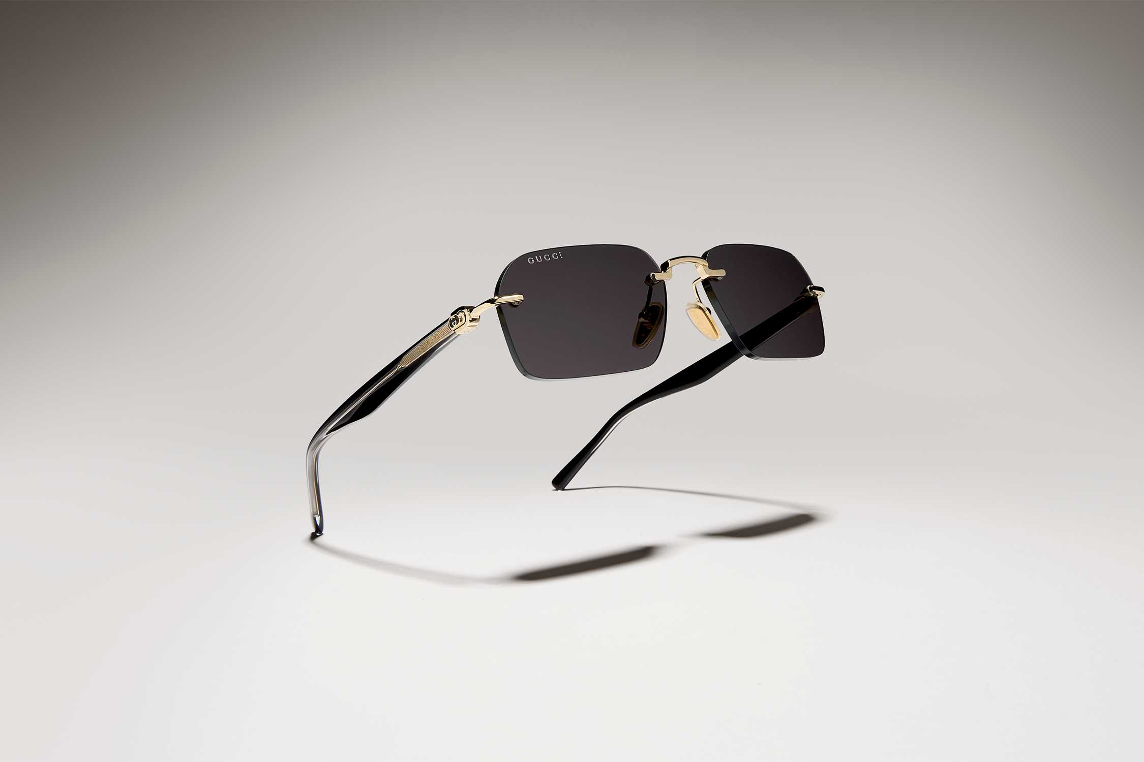 Gucci rimless gold black sunglasses