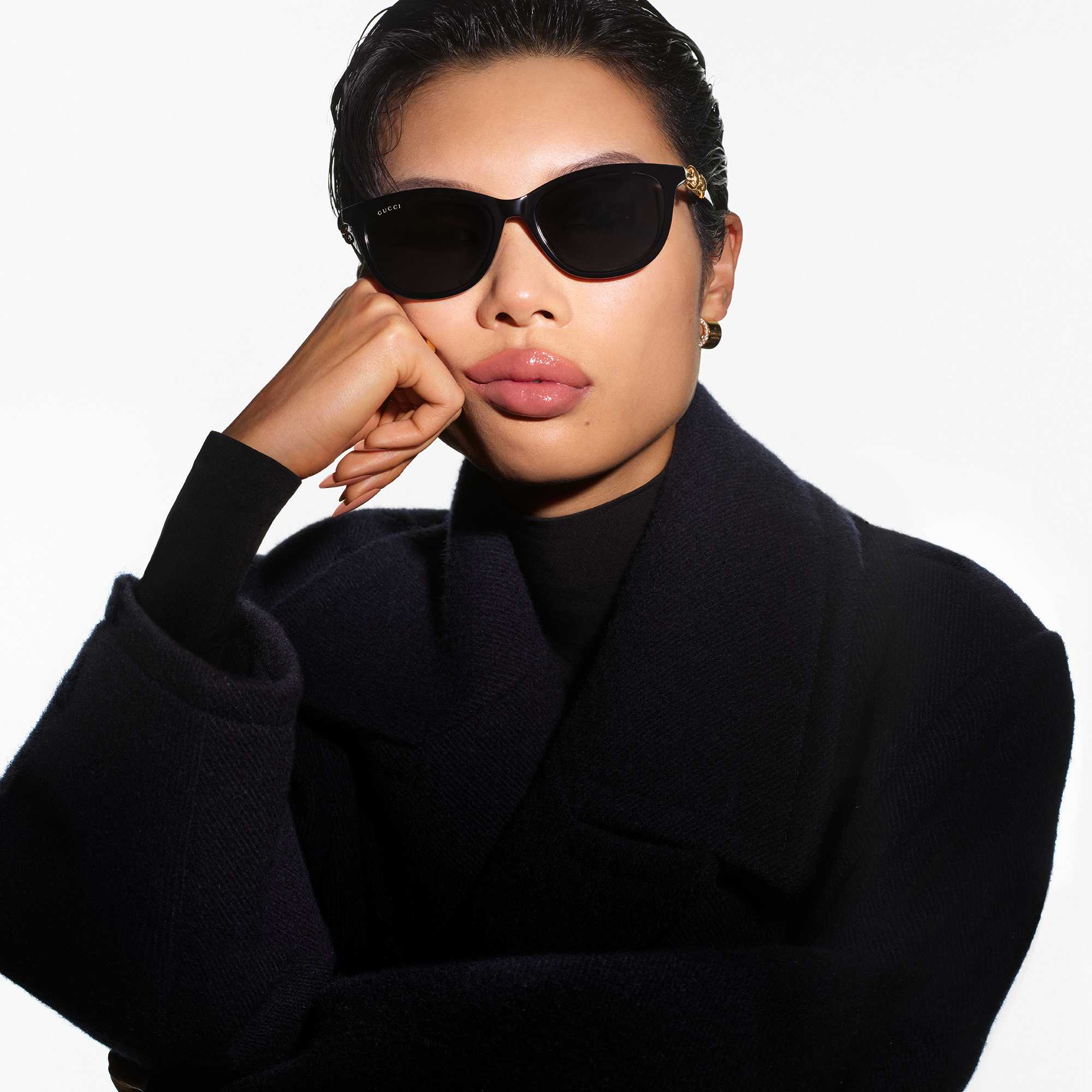 Black Gucci sunglasses, monogram bag