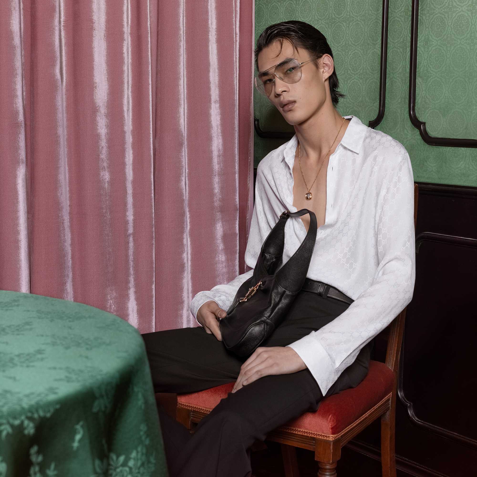 Black Gucci bag white shirt