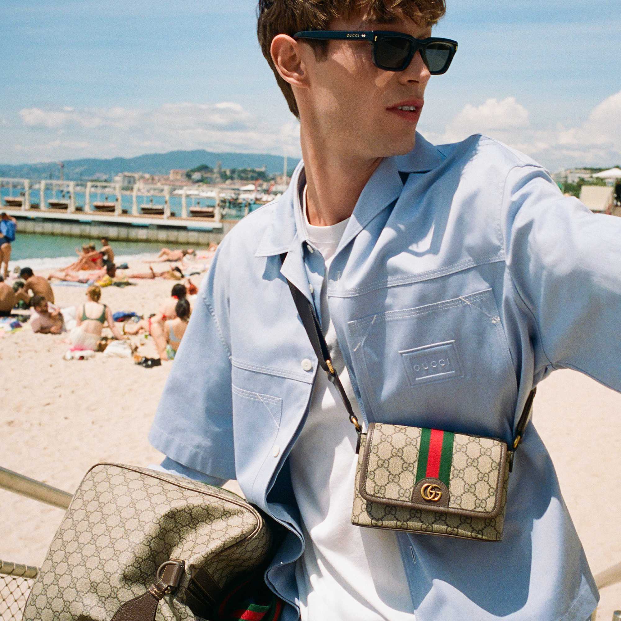 Black Gucci sunglasses, GG crossbody bag