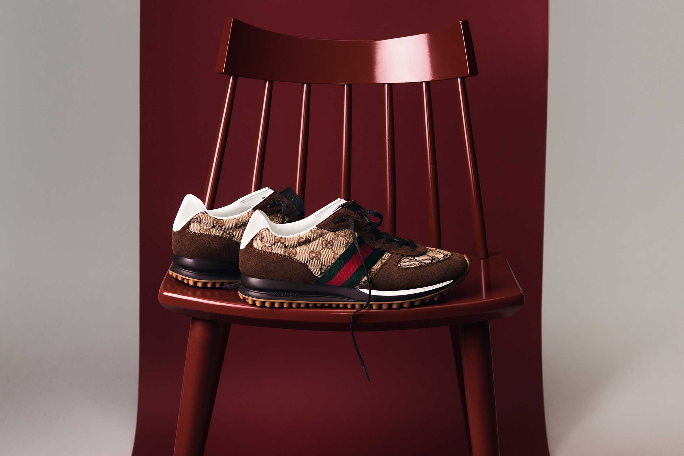 Gucci monogram trainers on chair