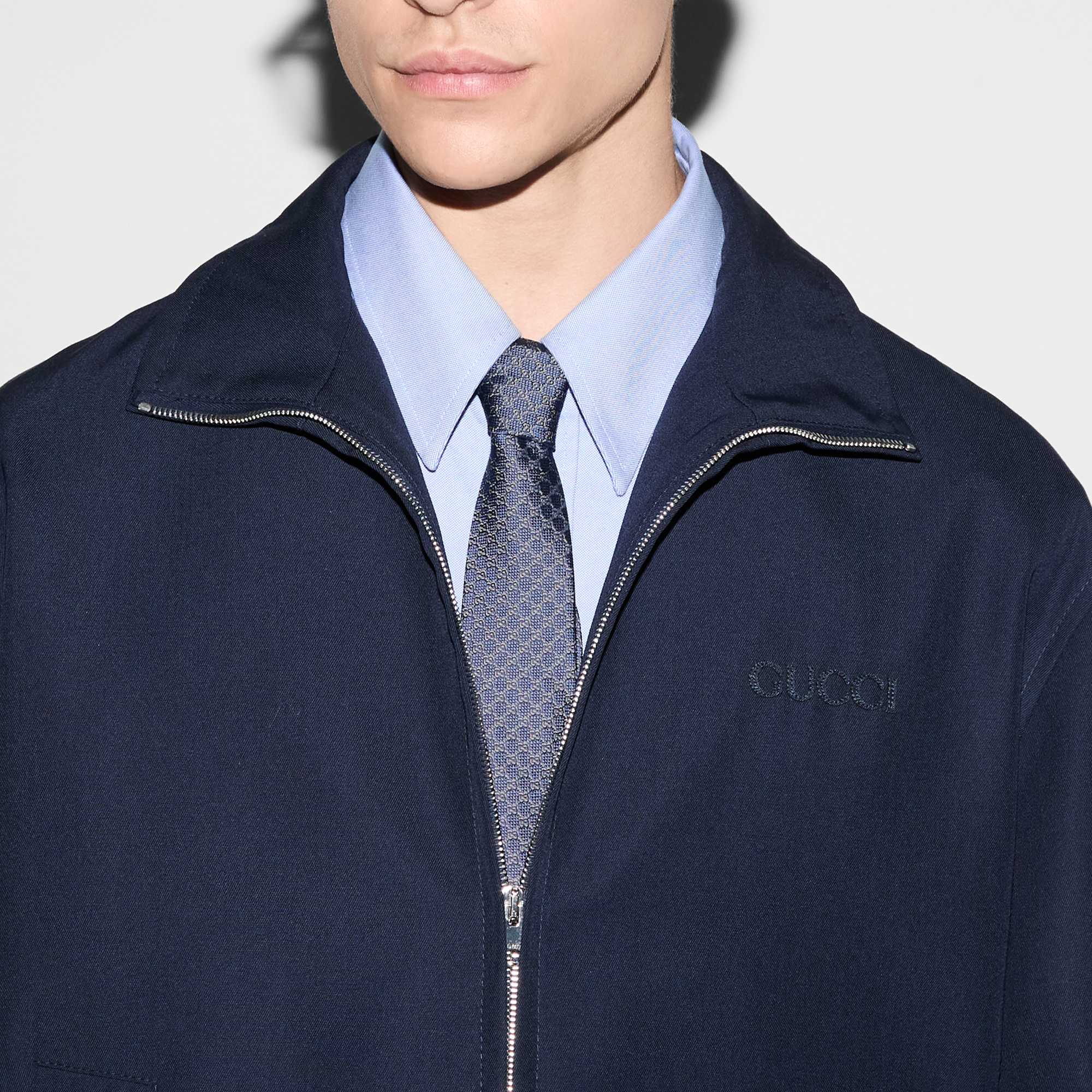 Navy Gucci jacket with tie