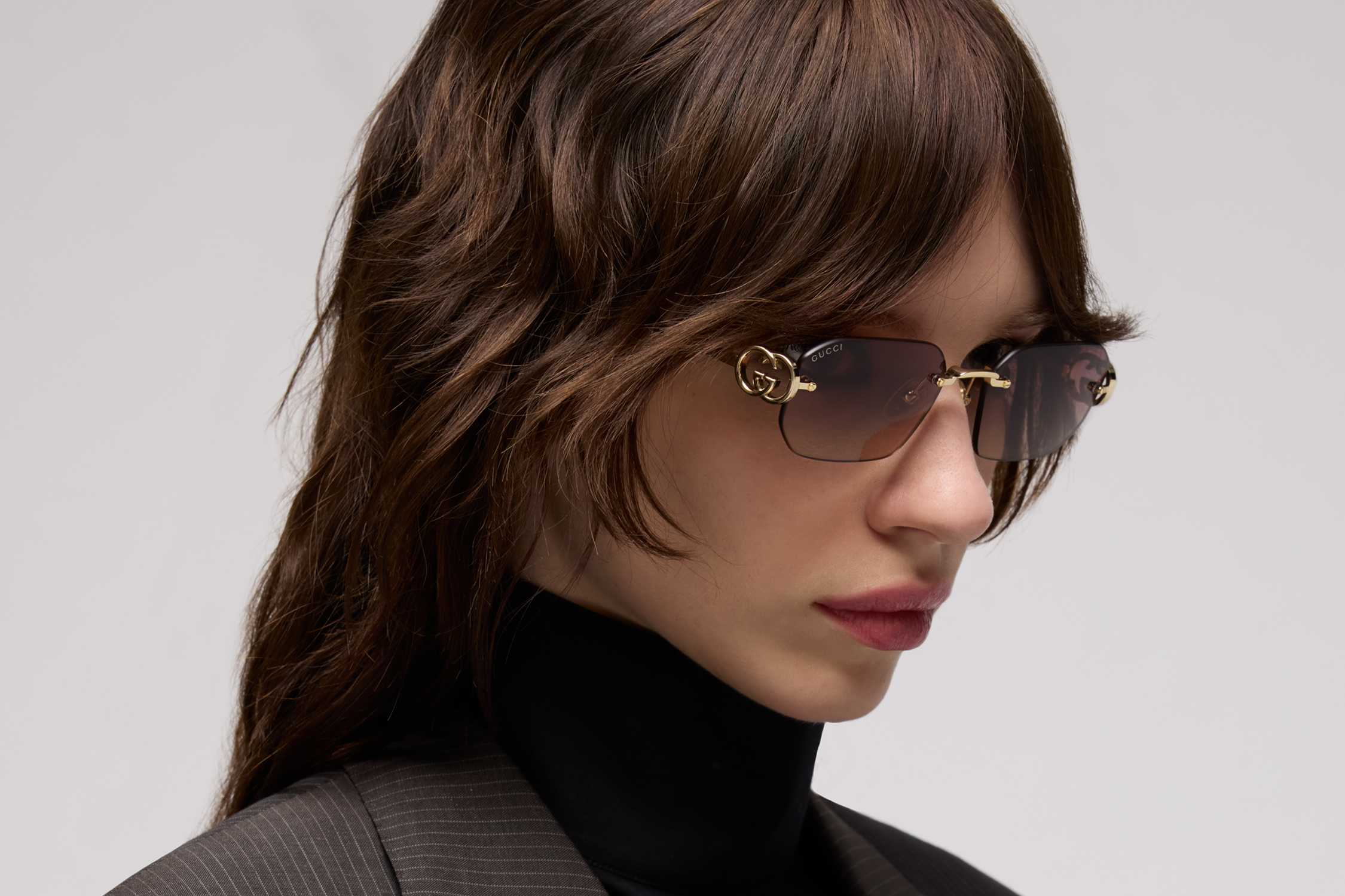 Gold rimless brown Gucci sunglasses