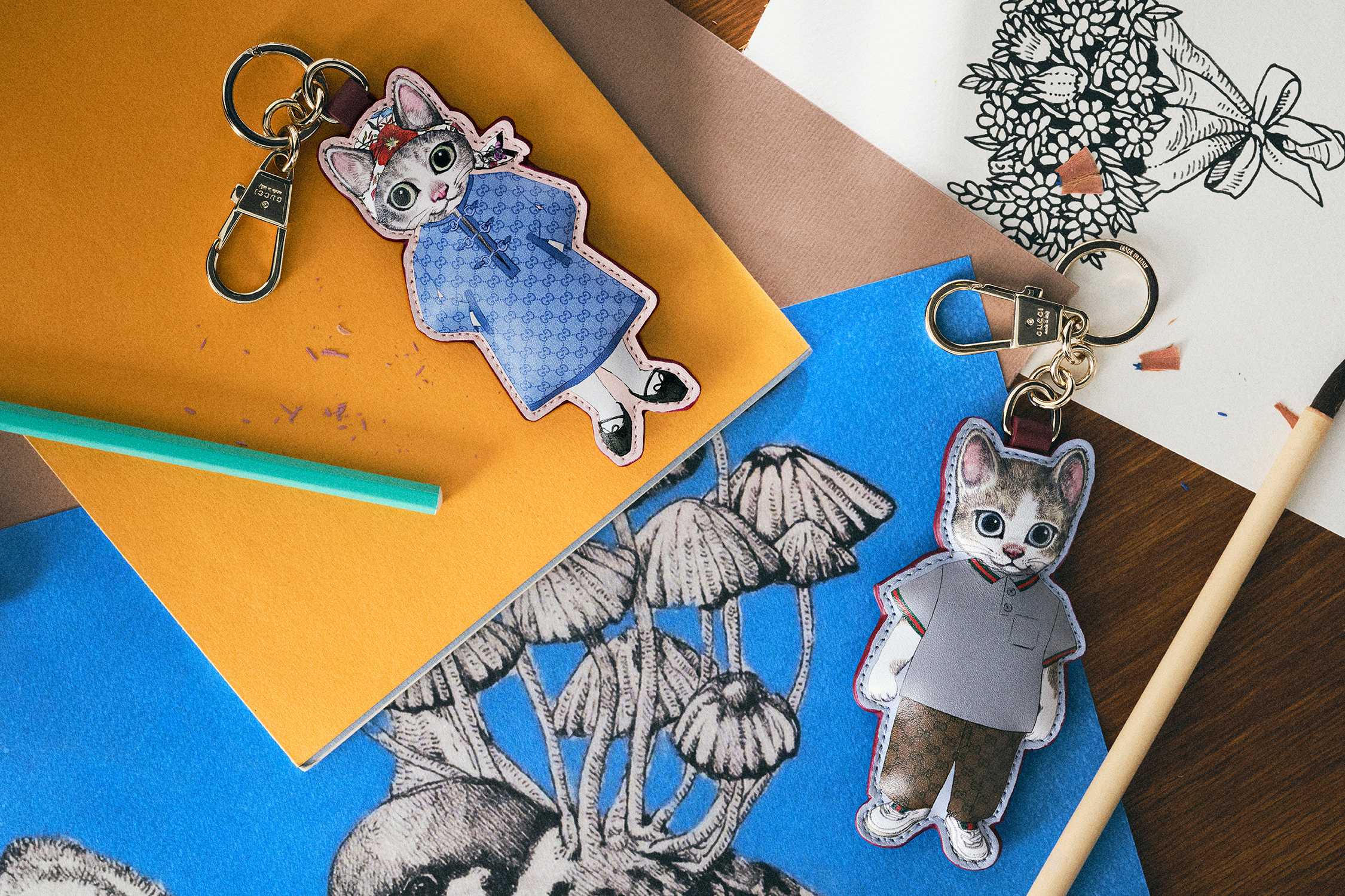 Gucci cat keychains on paper