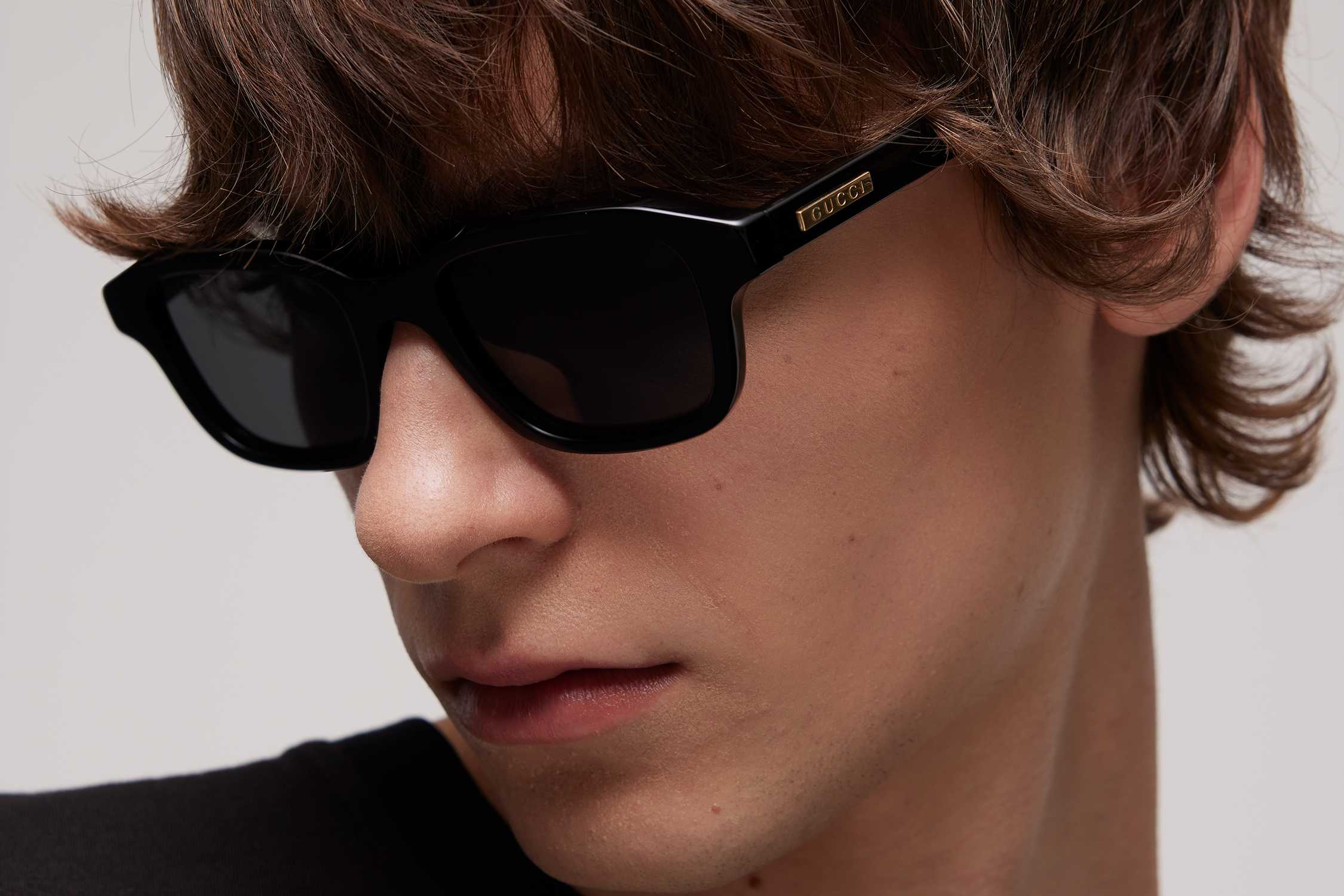 Black Gucci sunglasses gold detail