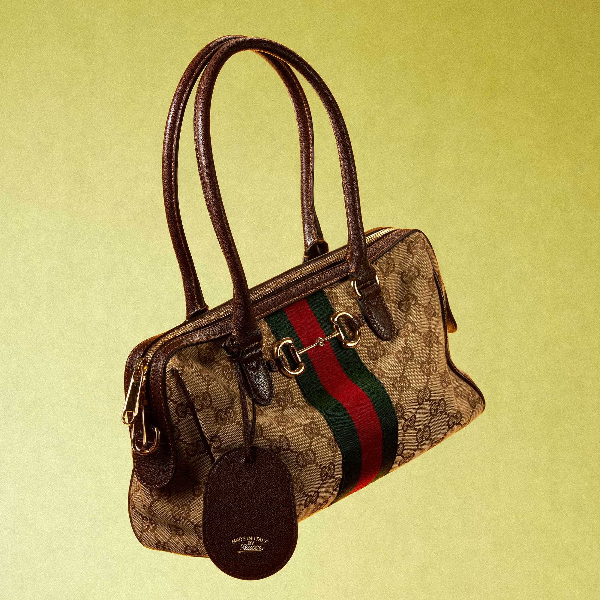 Black Gucci suit and handbag