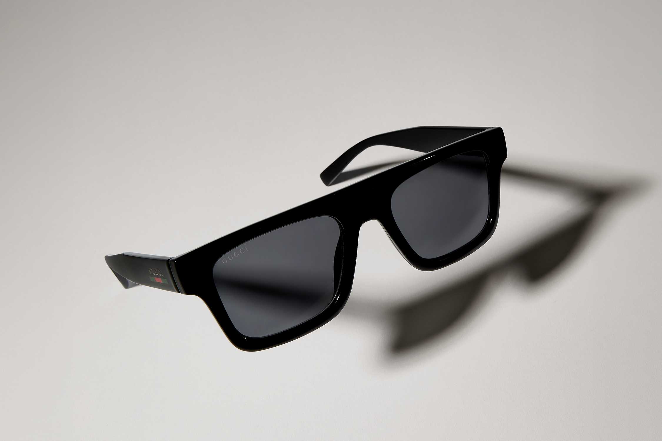 Black Gucci square sunglasses floating