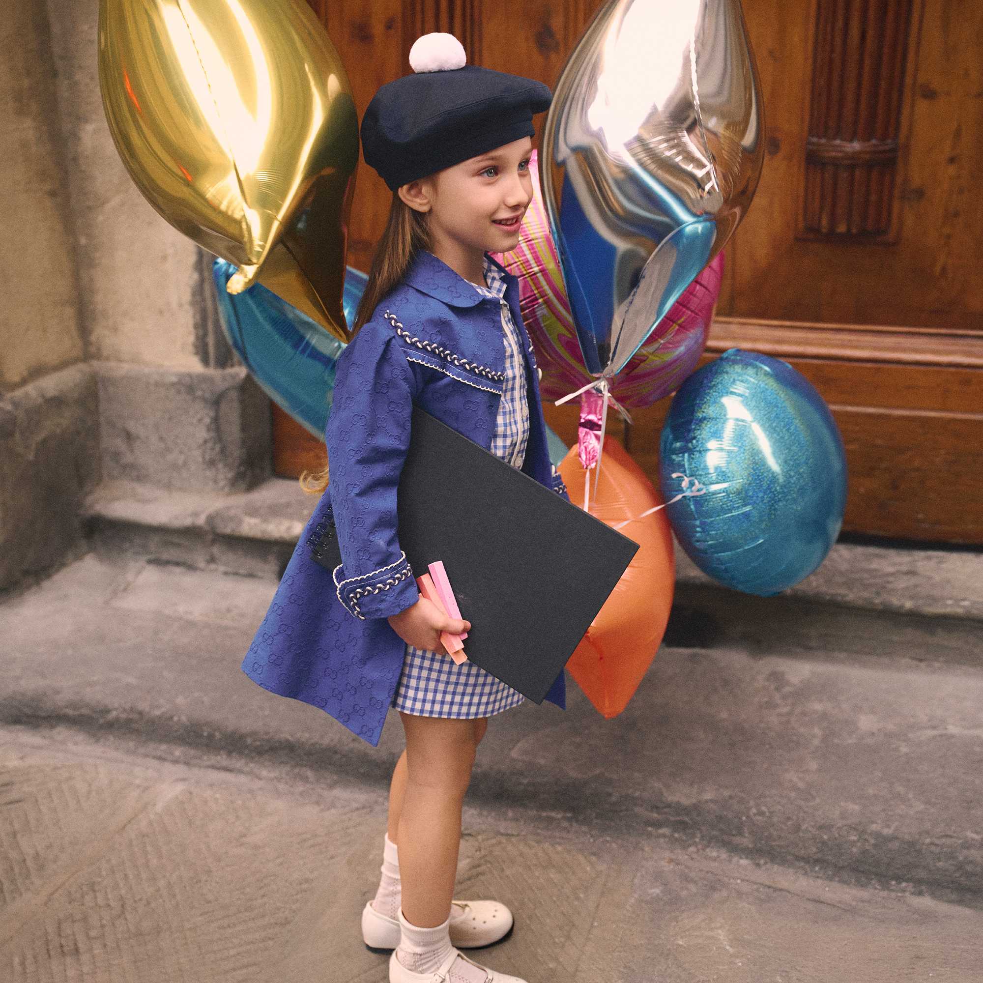 Children with Gucci signature bag