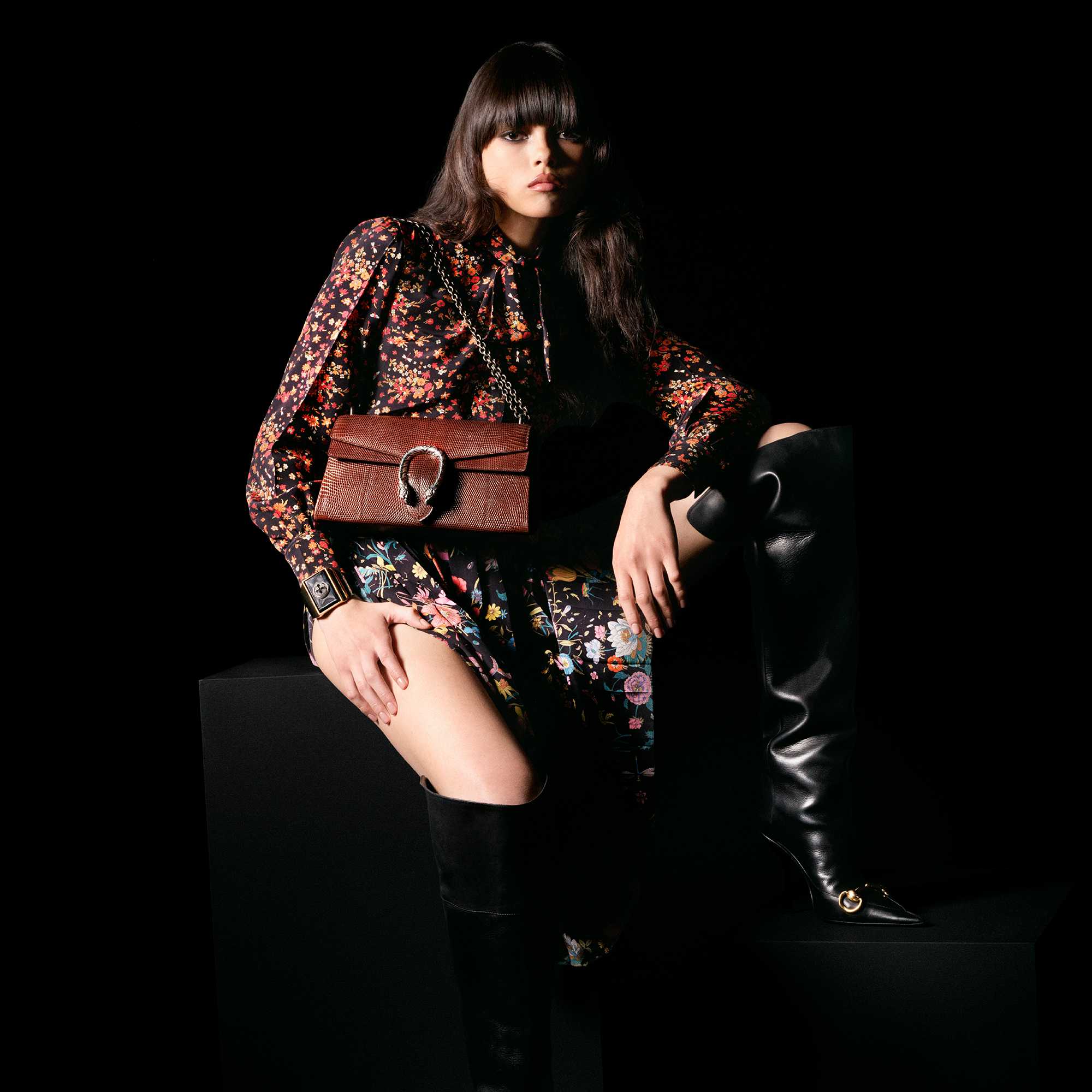 Floral Gucci look with boots and Dionysus shoulder bag