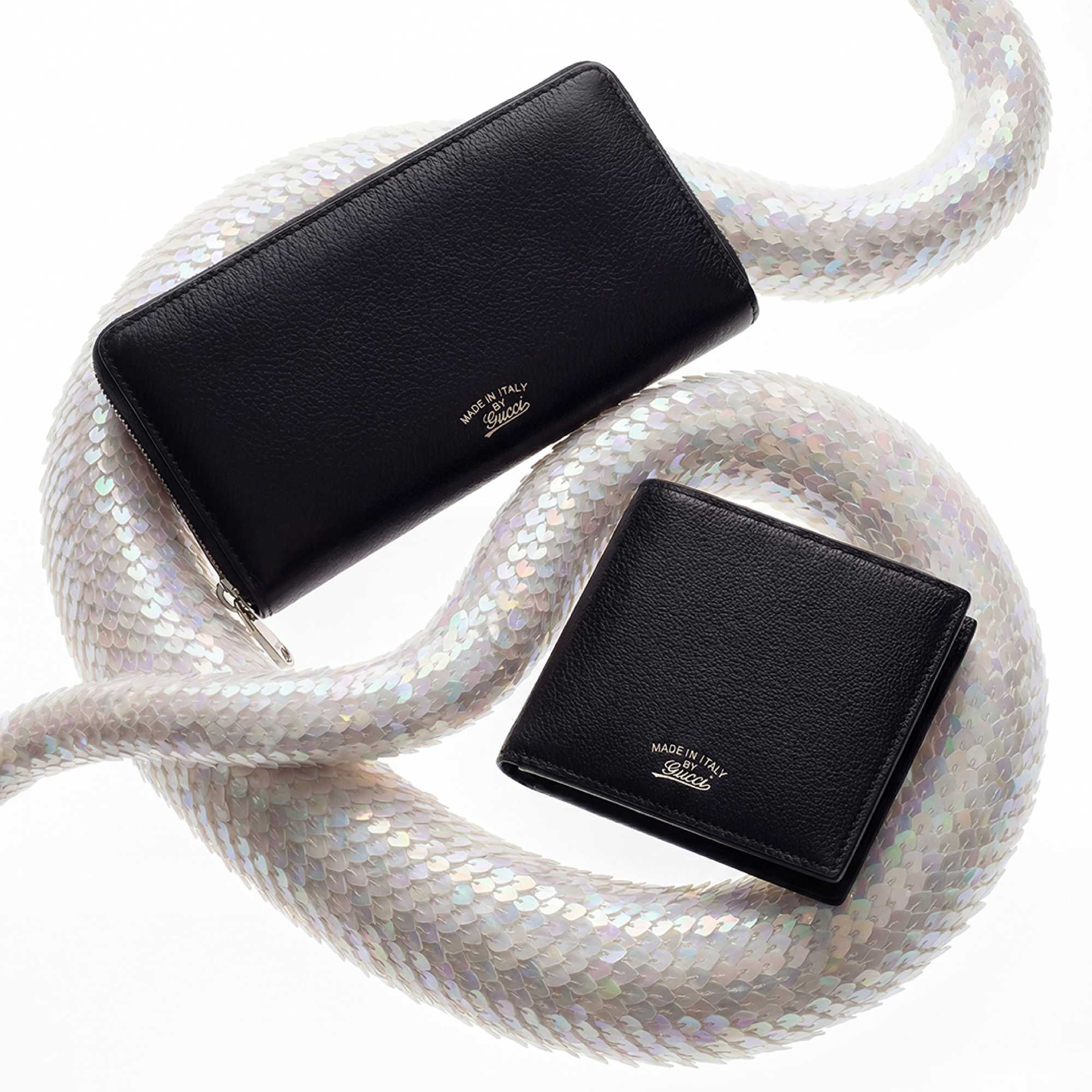 Navy Gucci wallets with sequins.