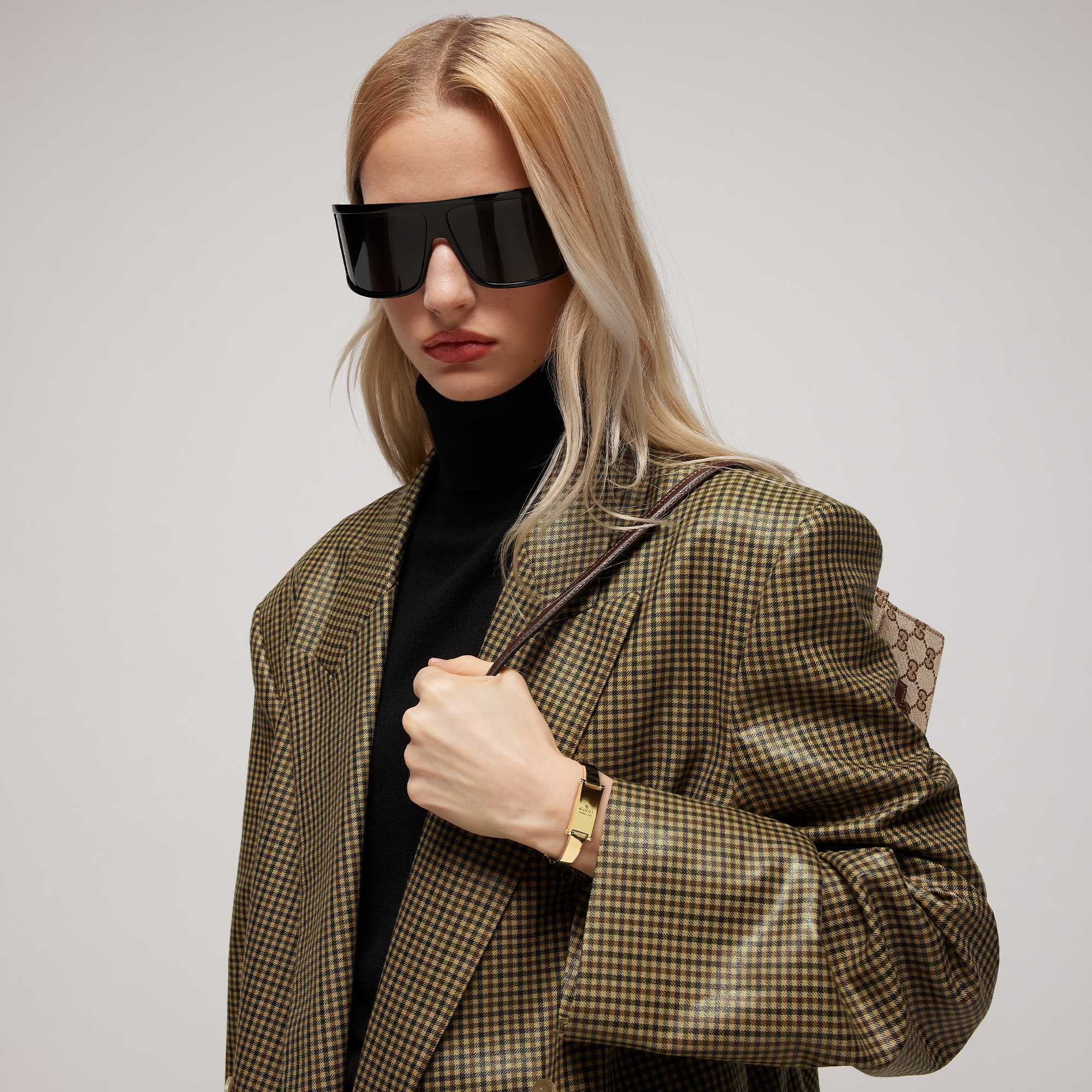 Model wearing  Gucci sunglasses