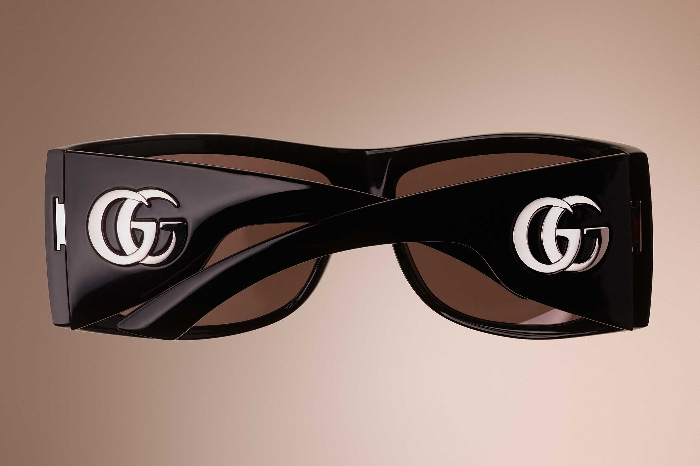 Black Gucci sunglasses with logo