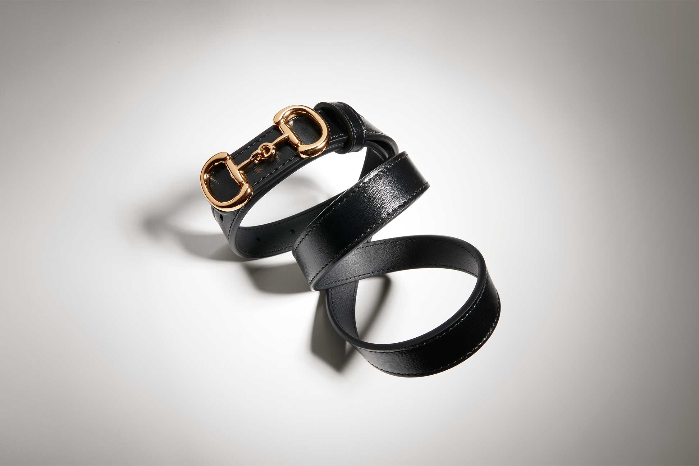 Black Gucci belt gold buckle