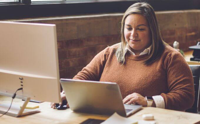 woman working on a laptop in an office