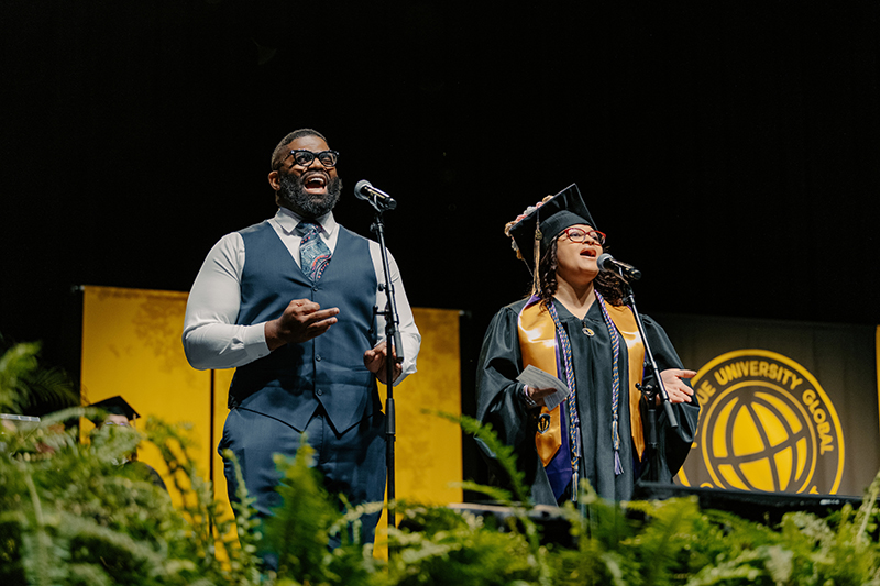 Deaon and Alina Smith perform the national anthem at Purdue Global’s commencement ceremony.