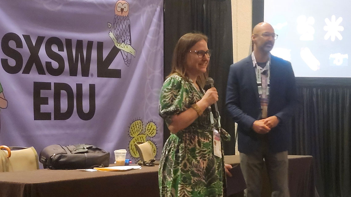 alt: Karen McGregor and Justin Thomason speaking at a conference.