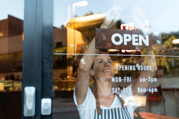 An entrepreneur hangs an