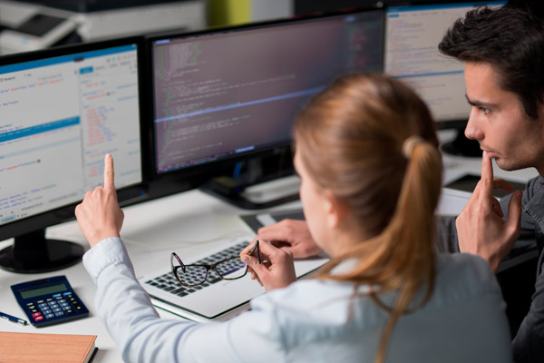 Man and woman looking at computer