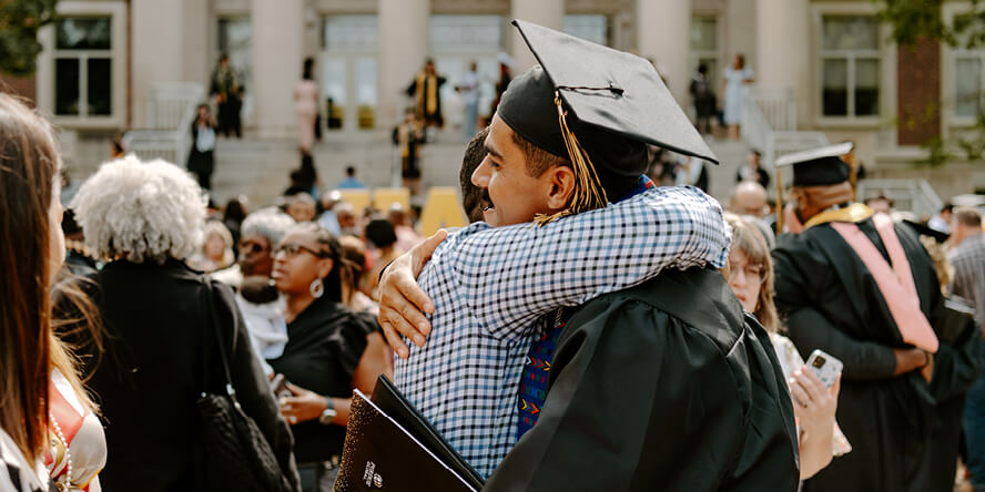 After the ceremony at Elliott Hall of Music, Montes receives a congratulatory hug from his brother. (Purdue University photo/Kelsey Lefever)
  