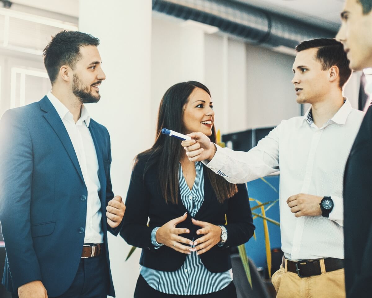 Group of professionals having a discussion in an office setting