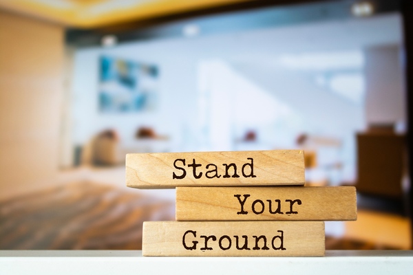 Wooden blocks with the words "Stand Your Ground" written on them.