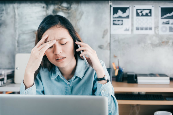 women looking stressed talking on phone