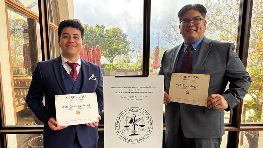 alt: Purdue Global Law School’s moot court team of Carlos Cepeda-Ojo, left, and Brian Gatus hold their fourth place Brief Award certificates.