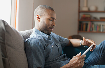 male student working on a tablet