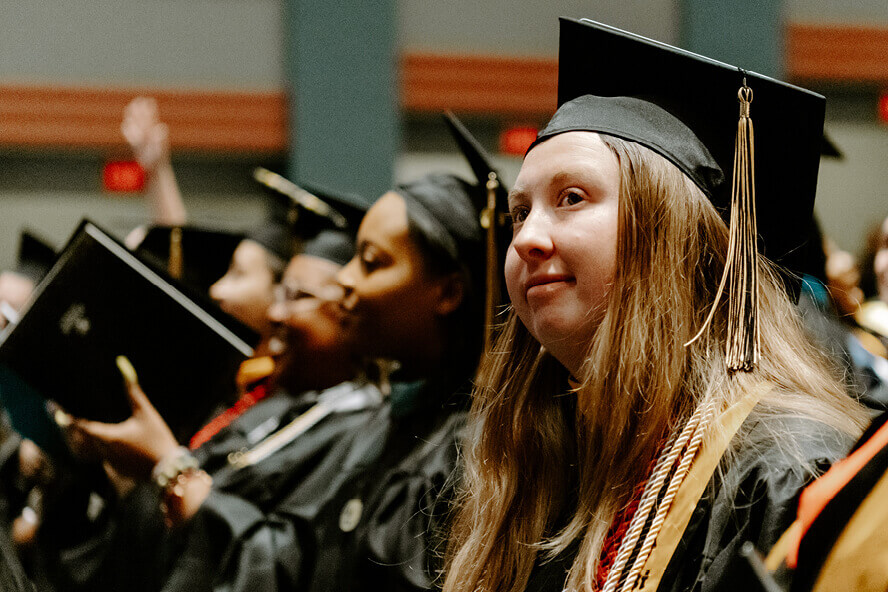 Kayli Peterson in her cap and gown at graduation.