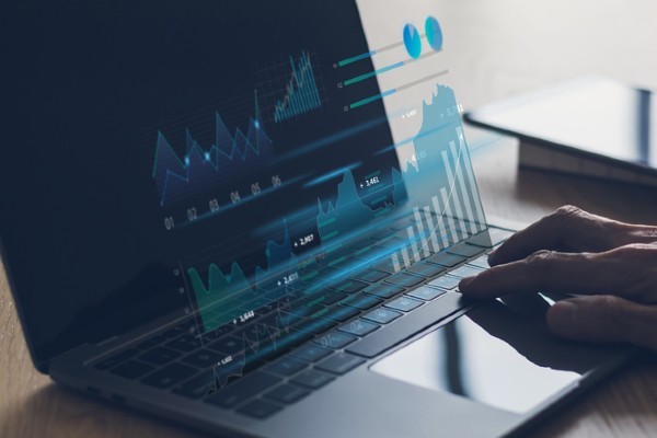 A laptop screen with charts and graphs of data