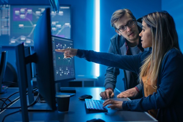 woman gesturing to computer screen