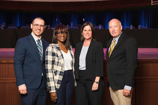 Stefan May, Bernina Dorsey, Kim Kass and Ritchie Loerch at a ceremony.
